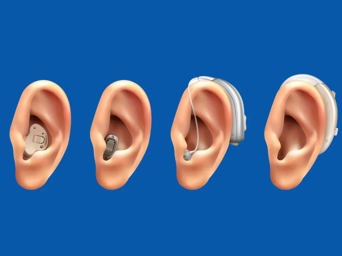 Four different styles of modern hearing aids on ears.