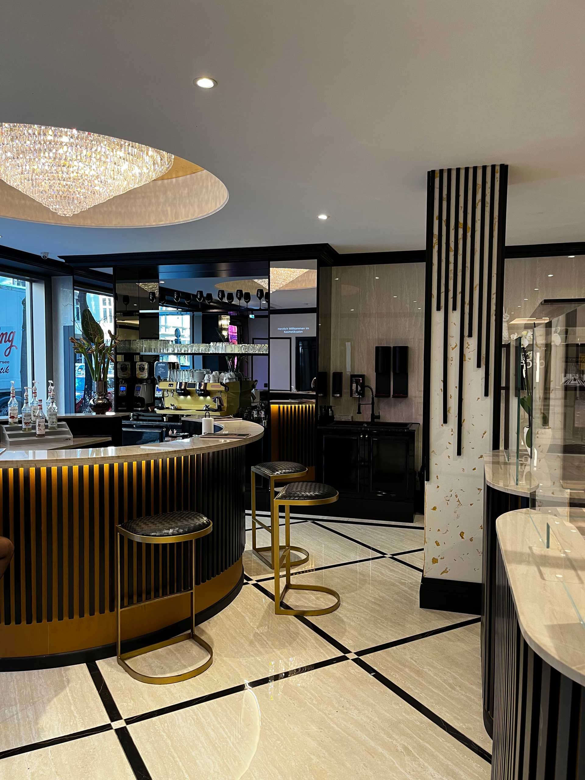 A large room with a bar and stools in it