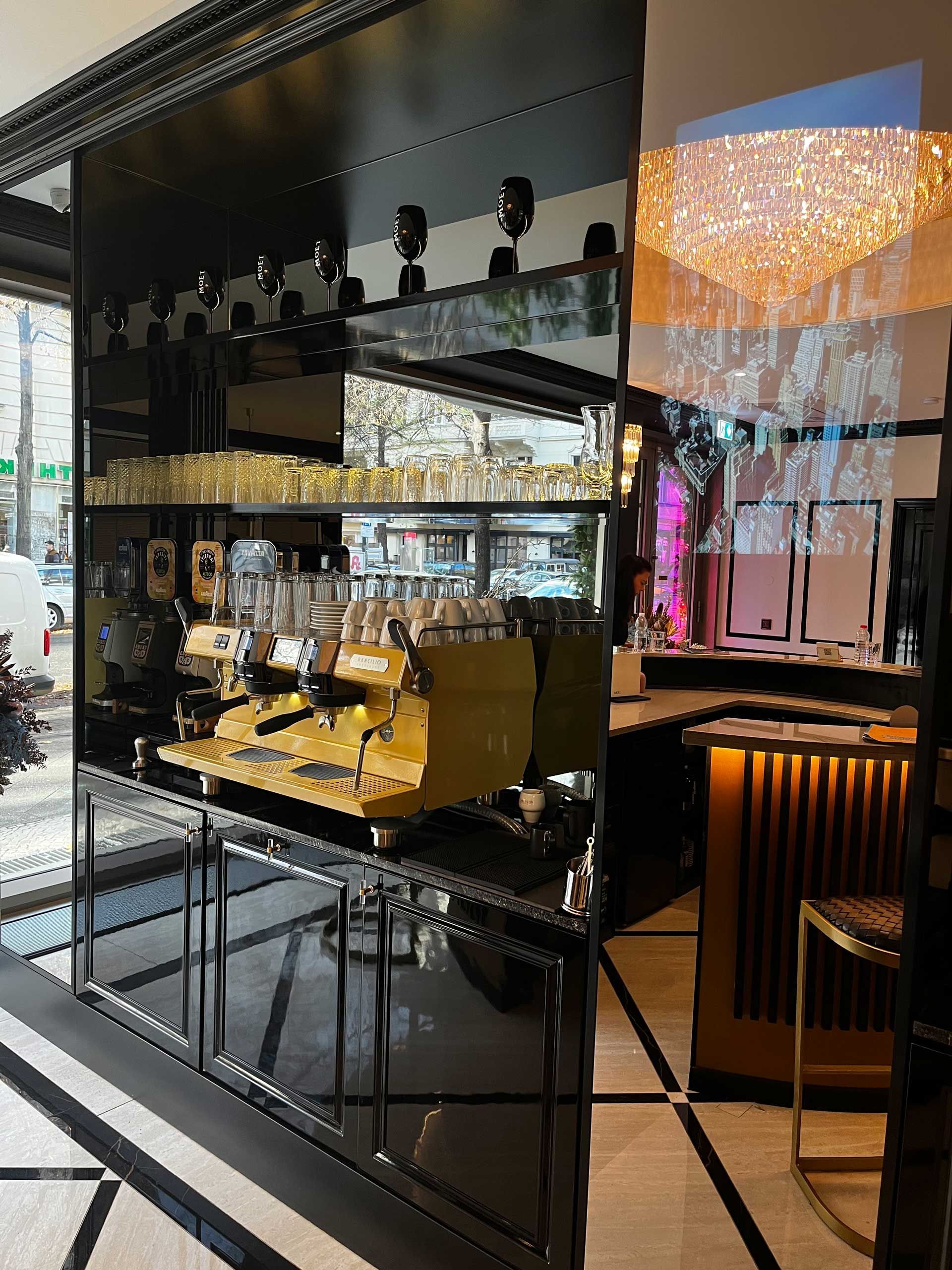 There is a yellow coffee machine in the middle of the room.