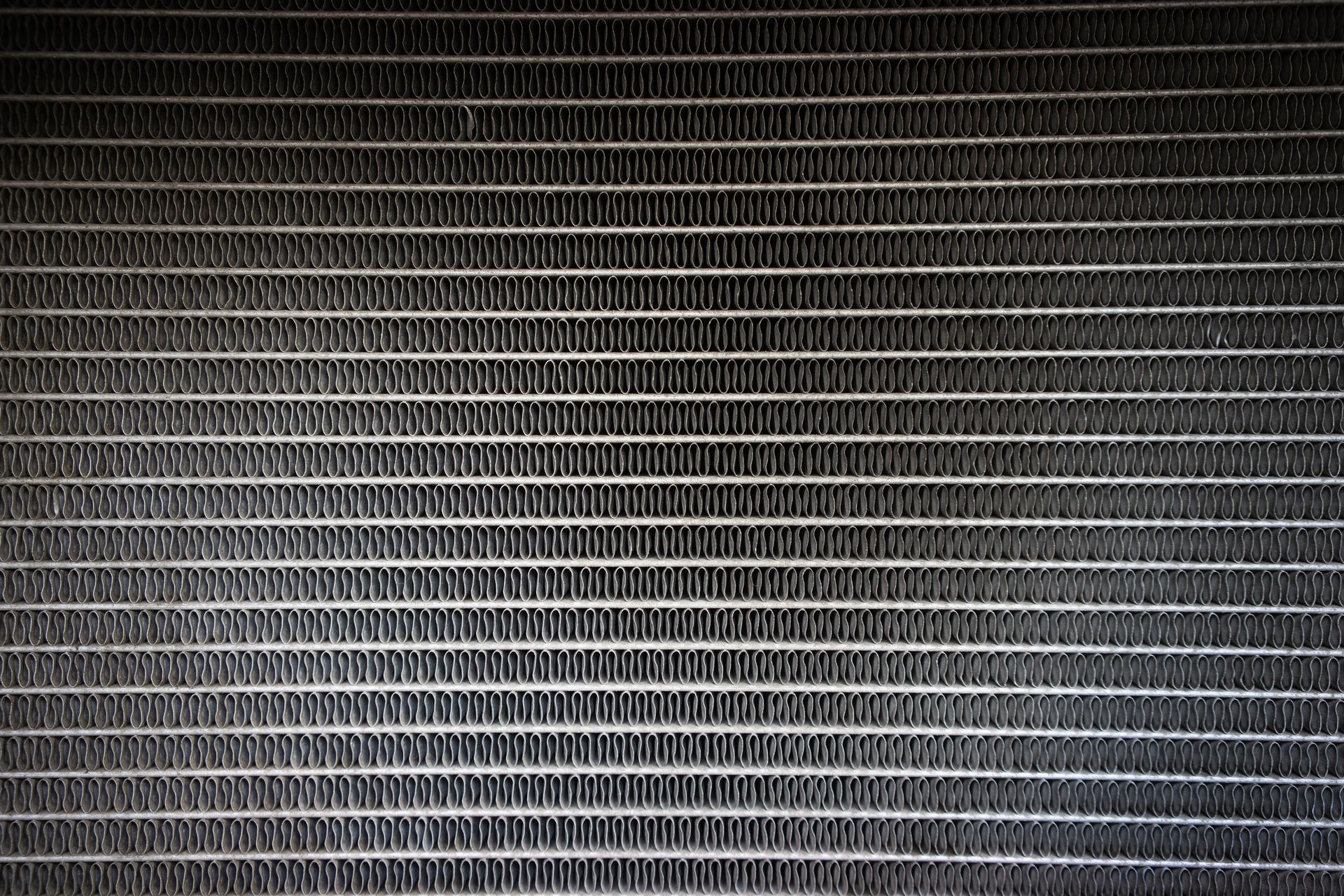 Close-up of cooling fins on a radiator made by heavy duty radiator manufacturers.
