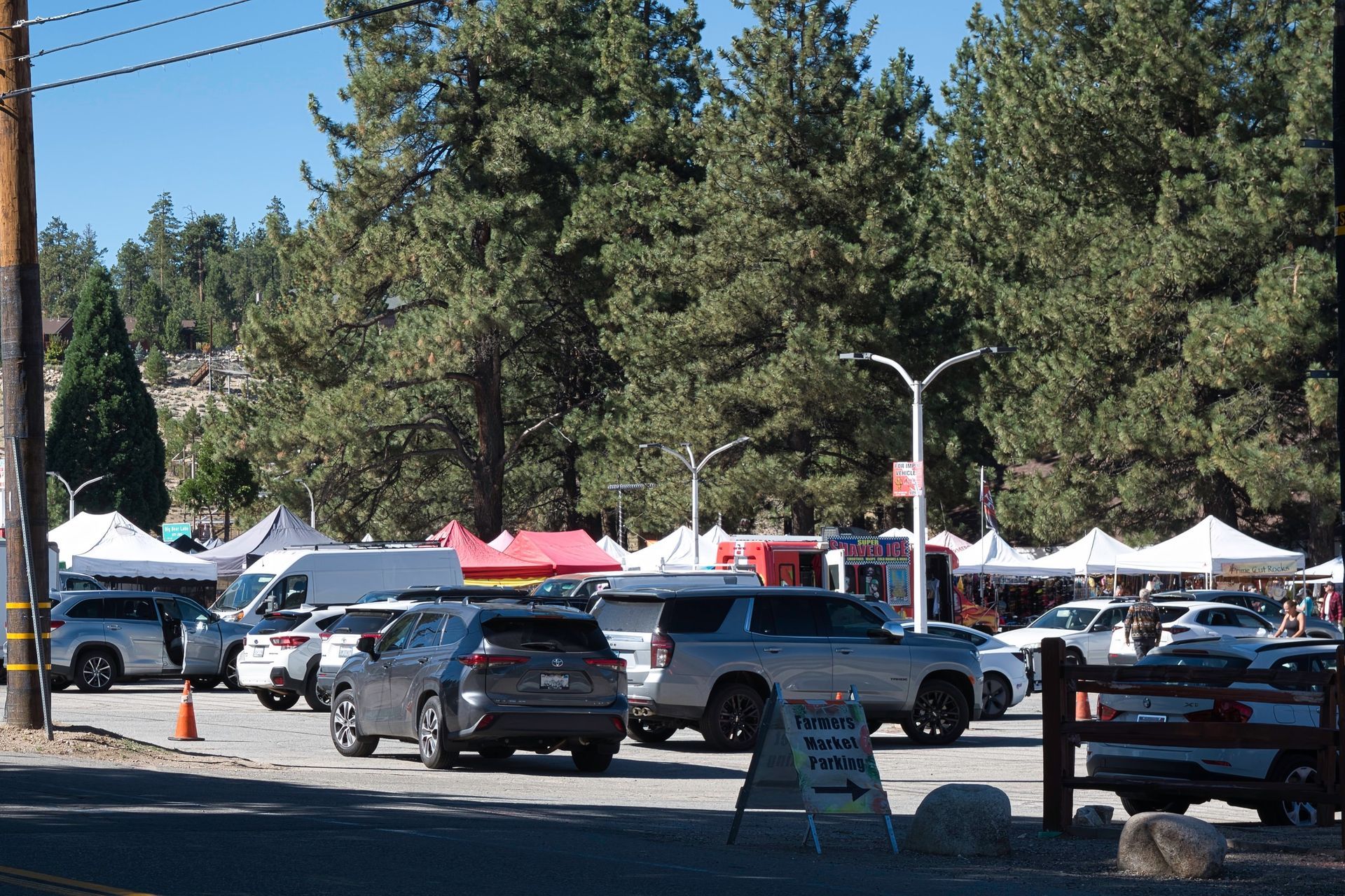 cars parked in front of booths at the Big Bear Farmers Market