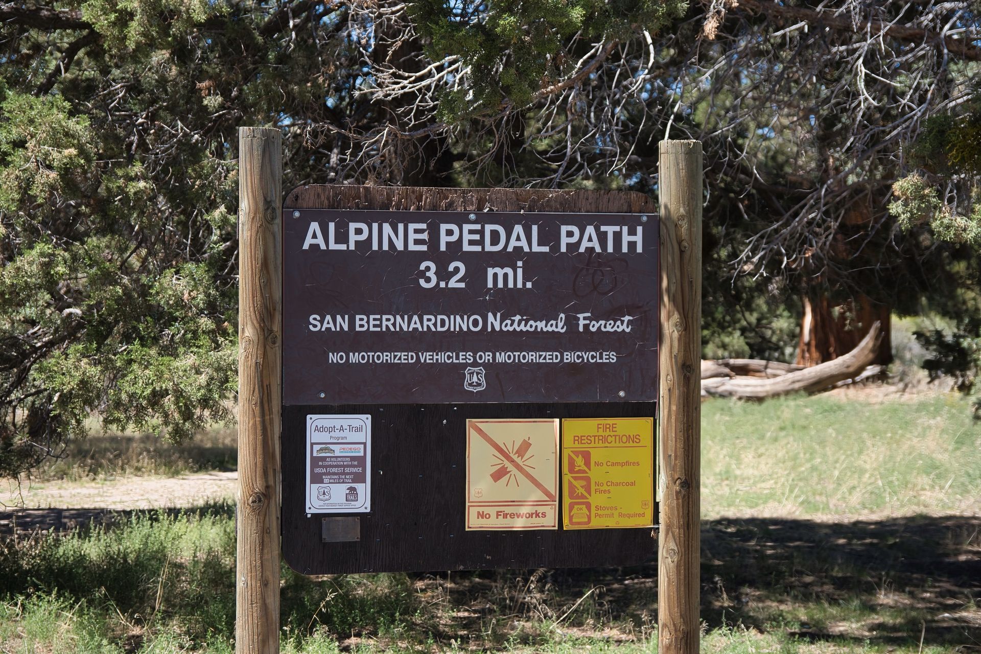 a sign that says alpine pedal path 3.2 miles