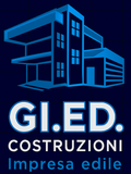 Il logo della GPG, un'impresa edile italiana, presenta il contorno blu di un edificio moderno sopra la scritta 