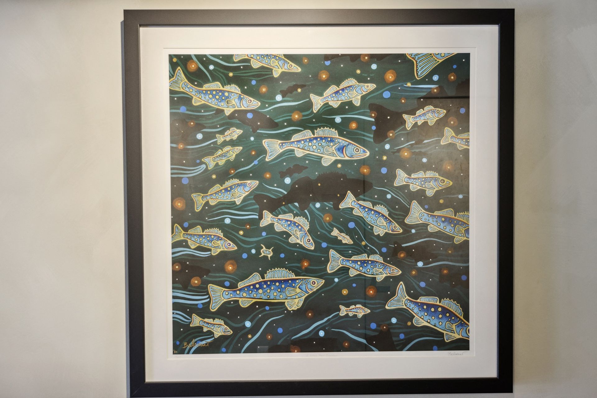 Framed underwater fish artwork on wall at Esox House in St. Paul, MN.