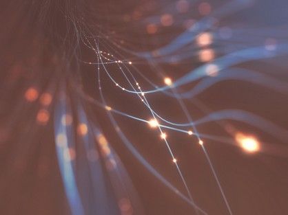 A computer generated image of a spider web with lights coming out of it.