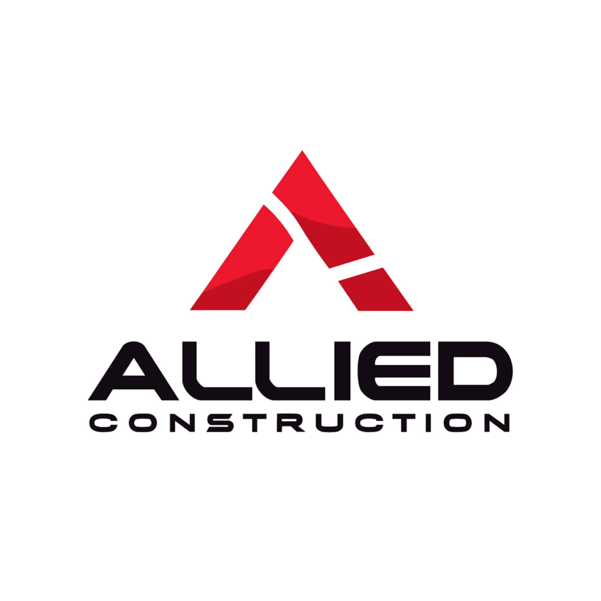 Construction worker in orange hard hat drills wood on a sunny day.