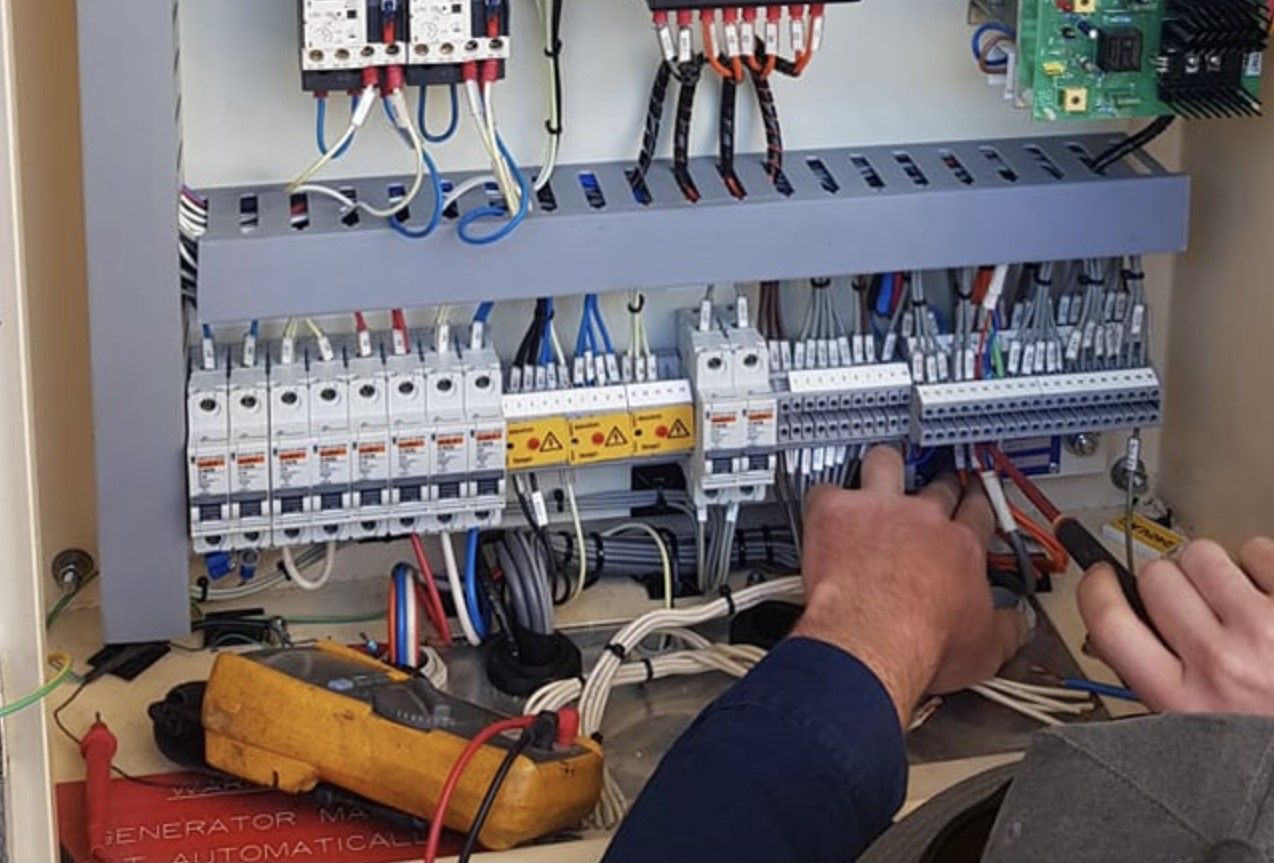 An Electrician Fixing a Circuit