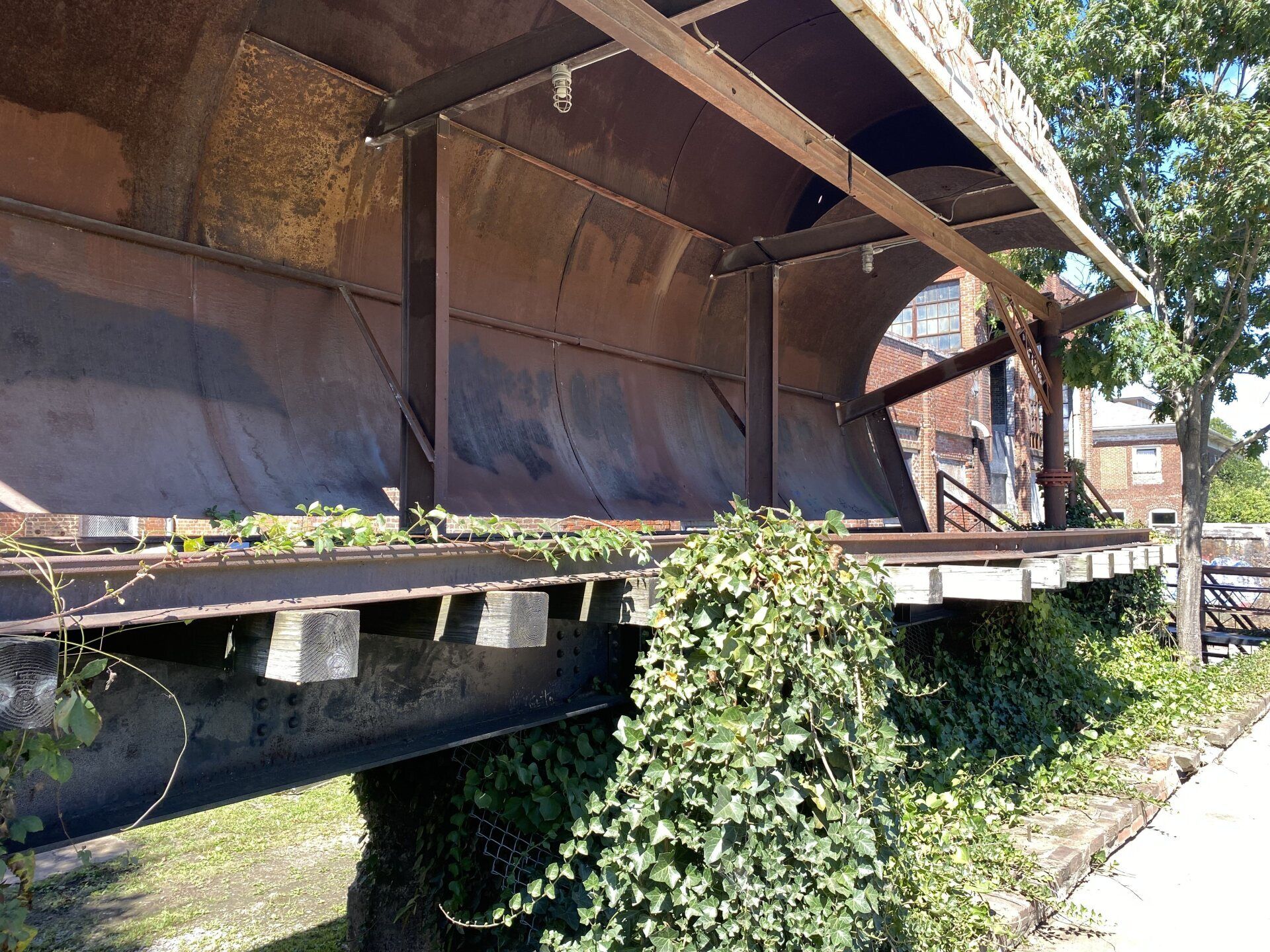 A bridge with a lot of plants growing on it
