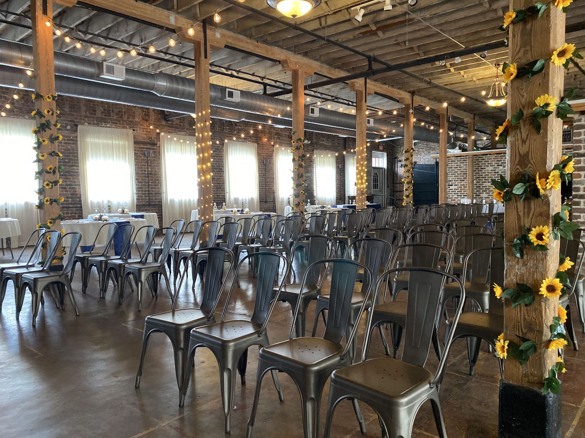 A large room filled with lots of chairs and tables.