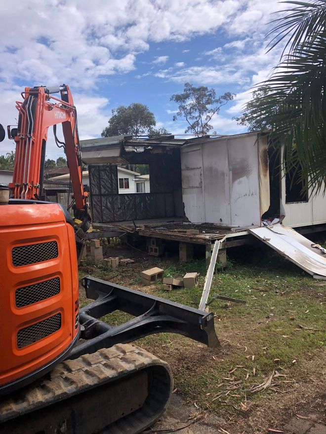 Excavator Demolishing House — Excavation and Demolition Services in Corindi Beach, NSW