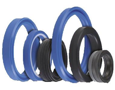 Un gruppo di guarnizioni di gomma blu e nere su uno sfondo bianco