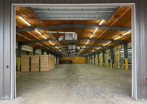 Empty Pallets Stored in Warehouse — Houston, TX — Quality Pallet
