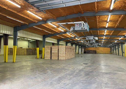 Wooden Pallets in Warehouse — Houston, TX — Quality Pallet