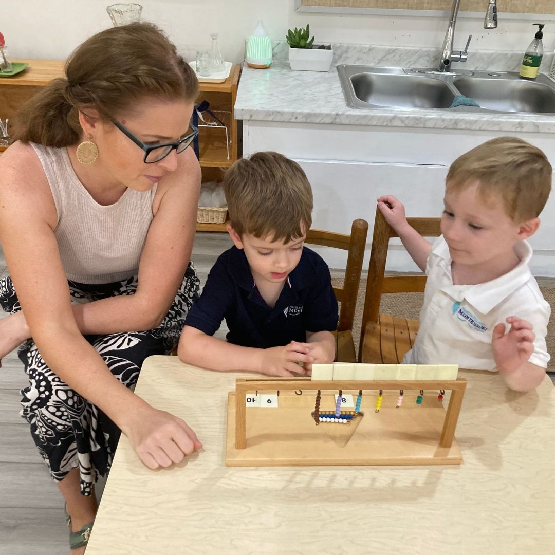 Students and guide in a Montessori classroom