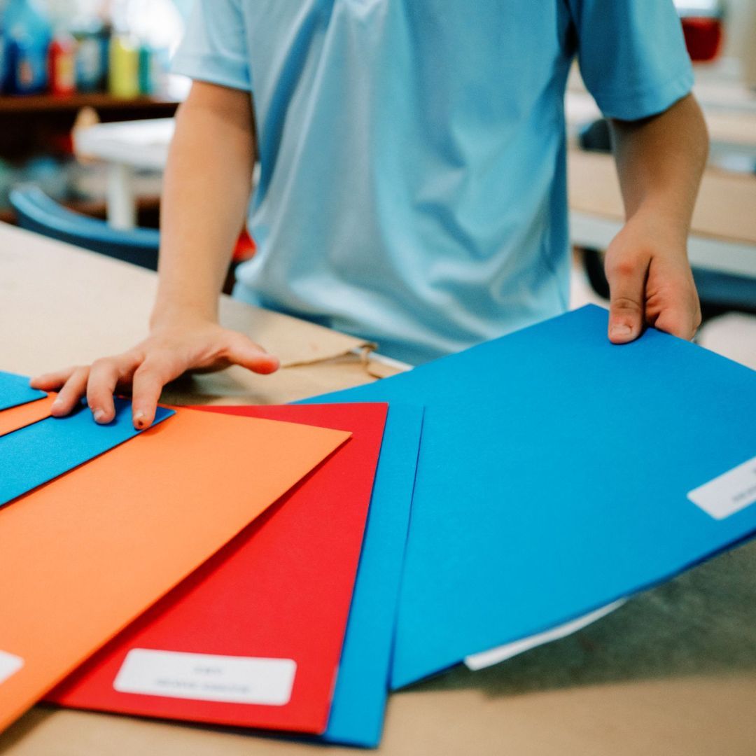 montessori child with folders