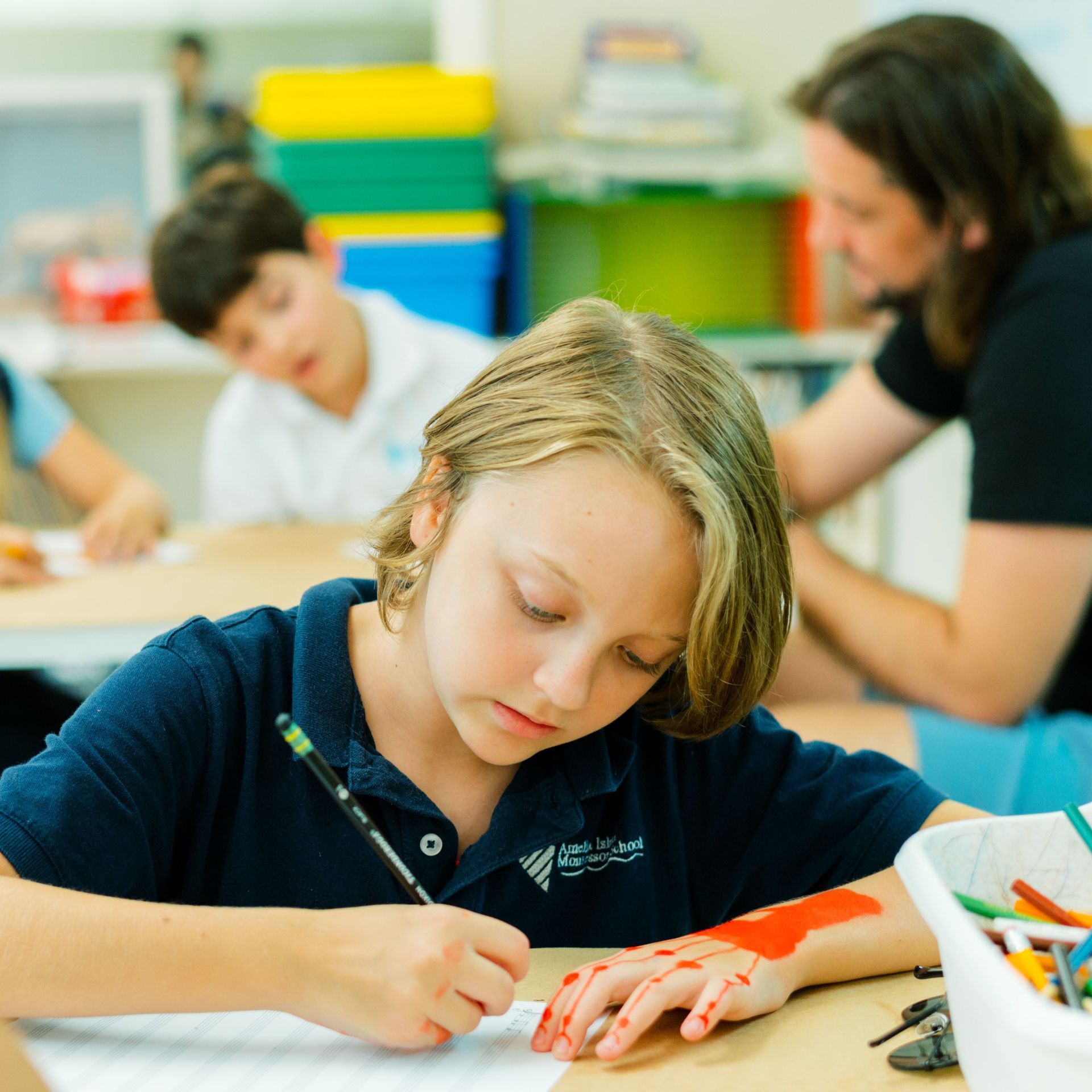 Child working on Montessori writing materials