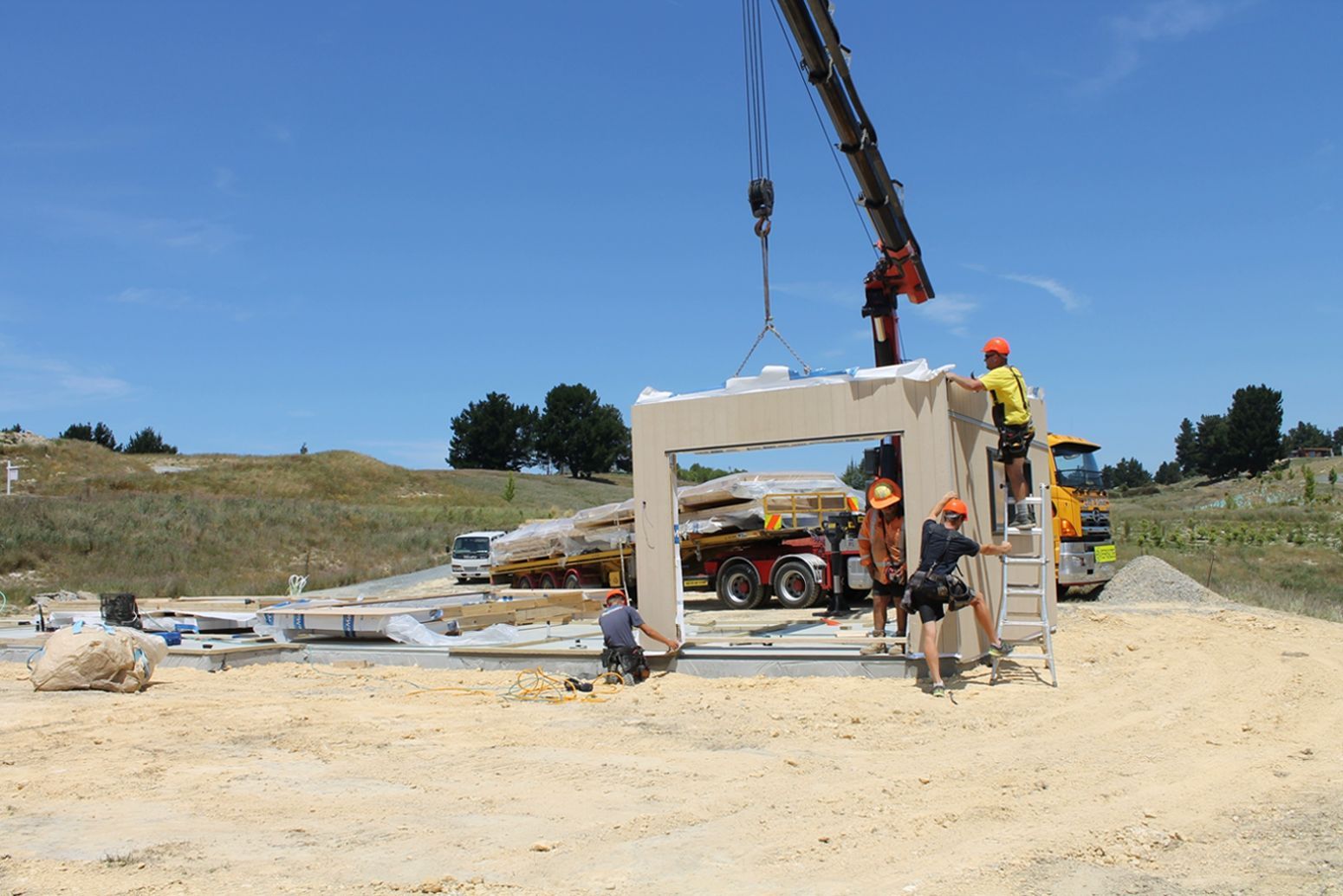 A group of construction workers are working on a building.