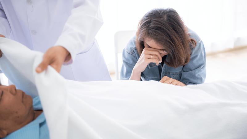 a woman grieving while in a wrongful death case represented by Lloyd Law Group of Arizona 