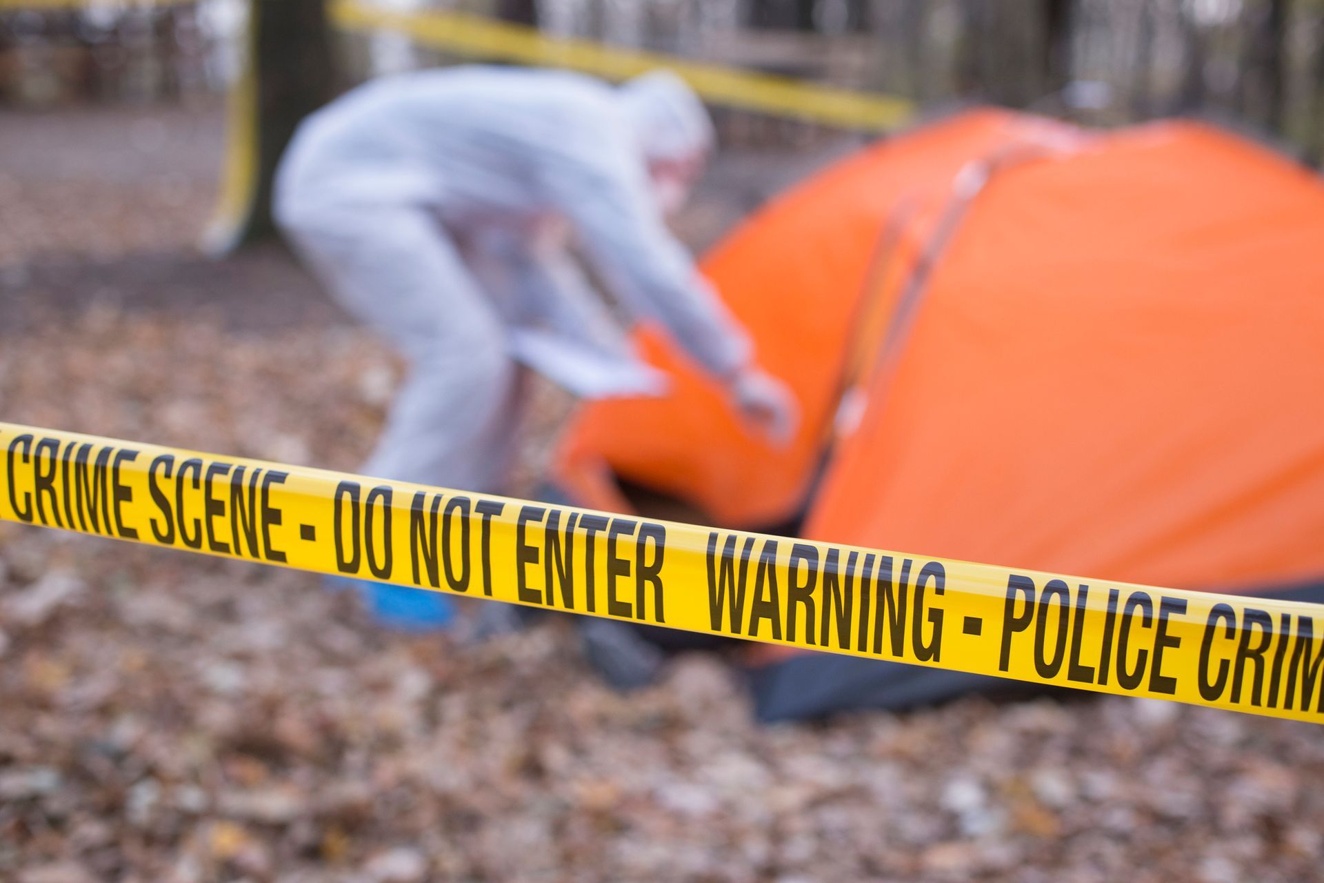 Crime scene tape in the woods – Wilmington, DE - T & H Bail Bonds Agency LLC