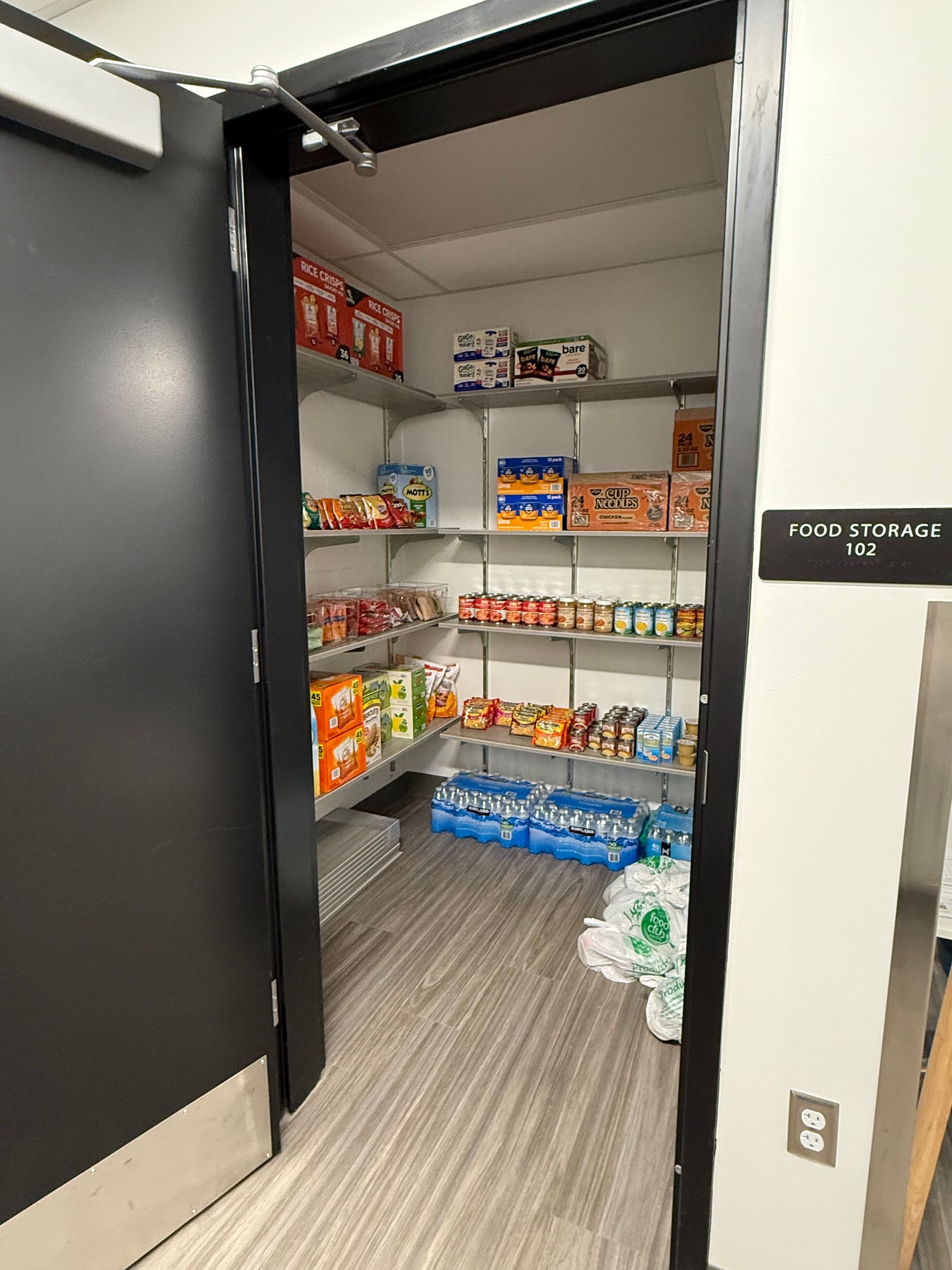 A pantry filled with lots of food and drinks.