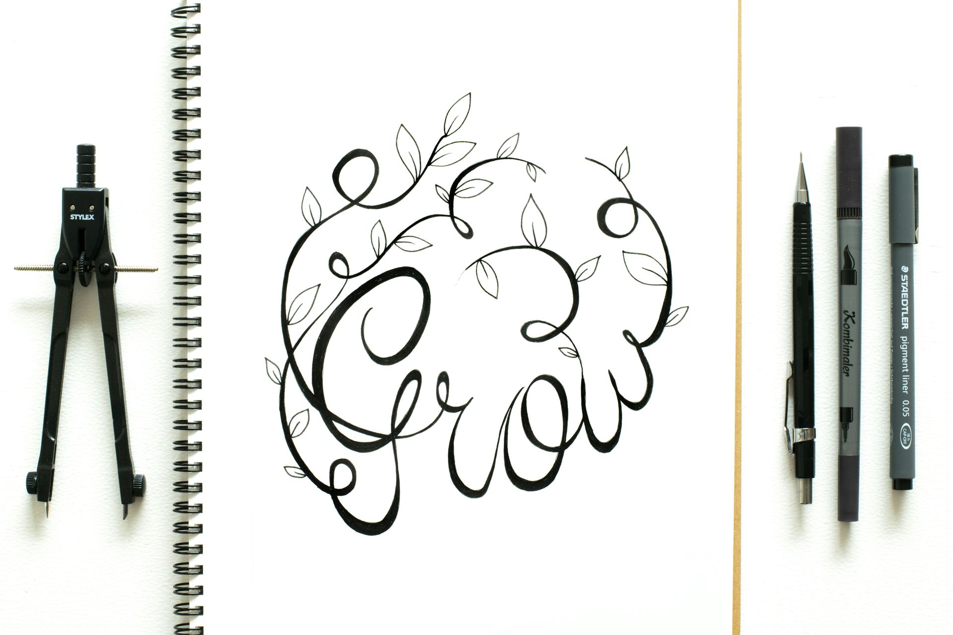 A drawing of a vine with the word grow on it