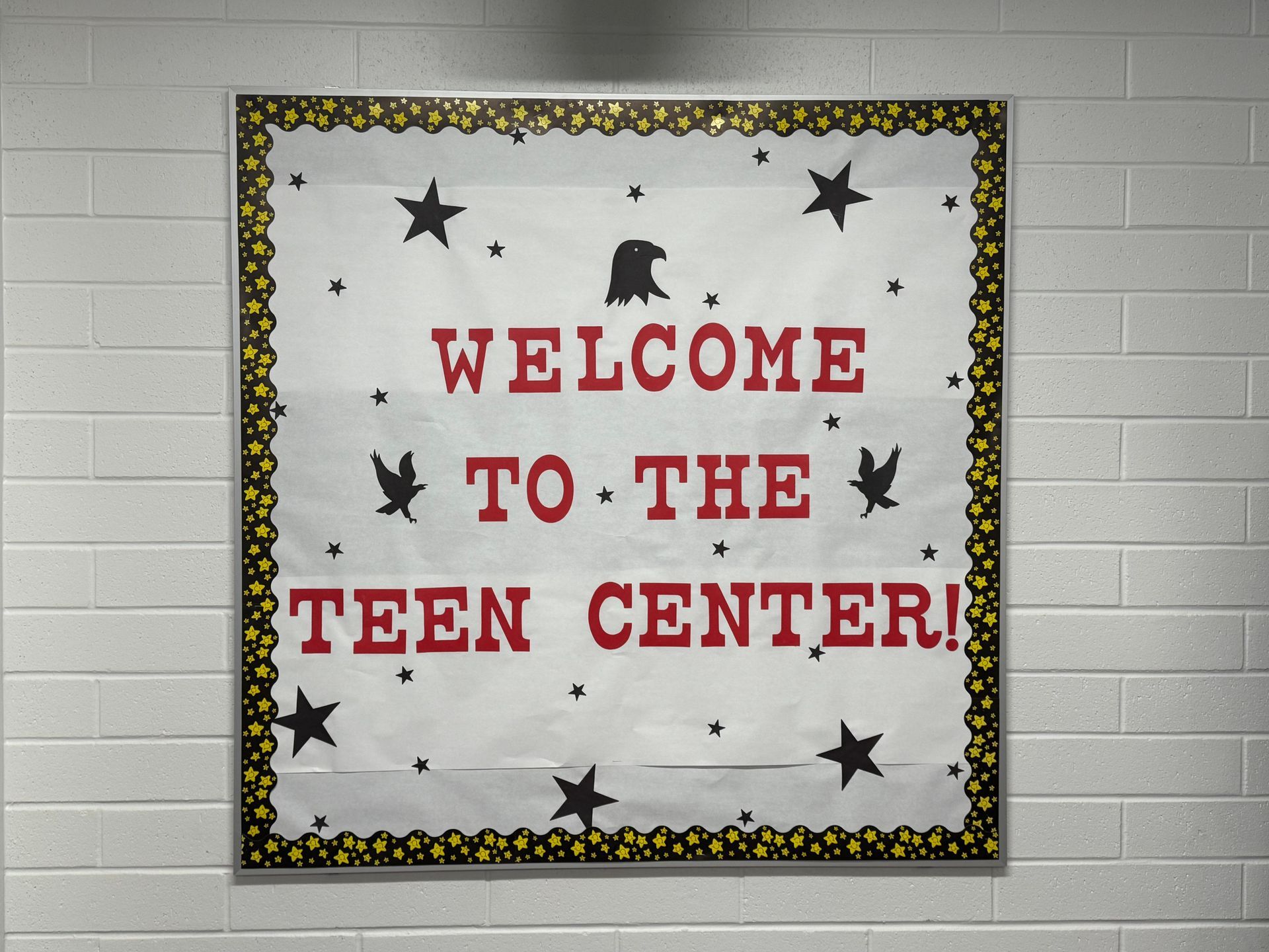 A bulletin board that says welcome to the teen center