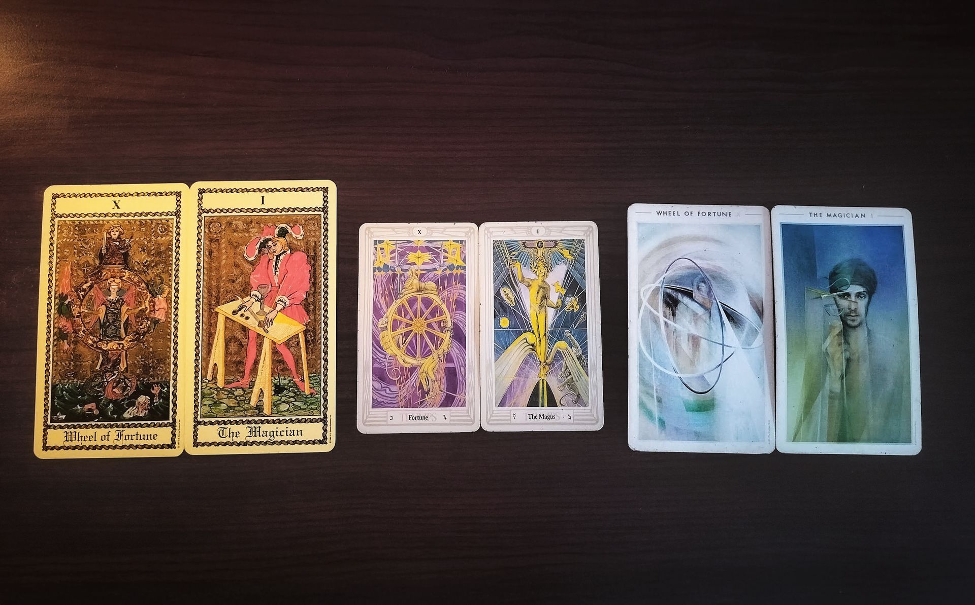 Six tarot cards face up on a dark surface. Two on the left: Knight of Wands and Two of Cups. Four to the right: The Wheel, Star, Nine of Swords, and Two of Pentacles.