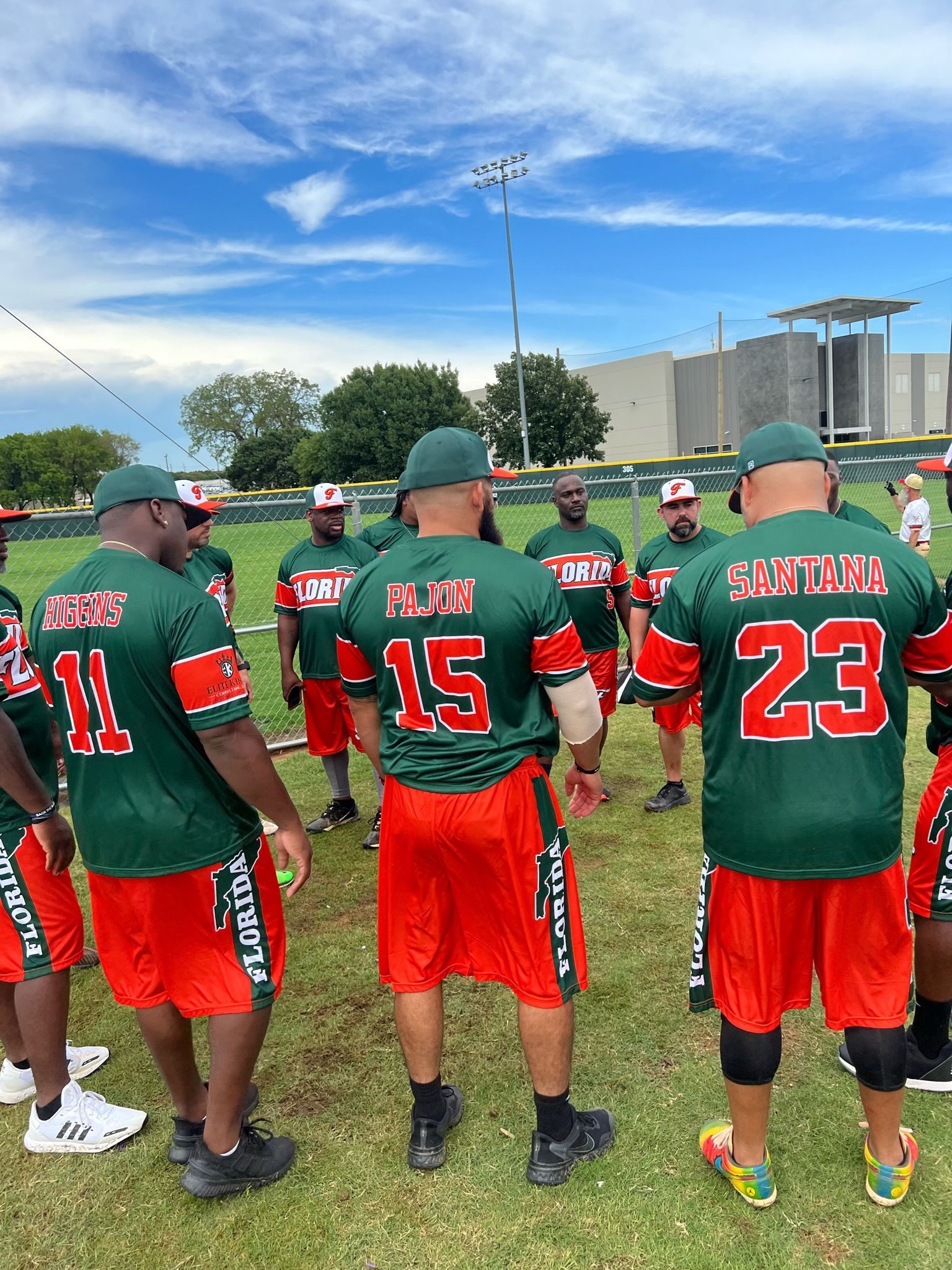 Team huddle in green and red