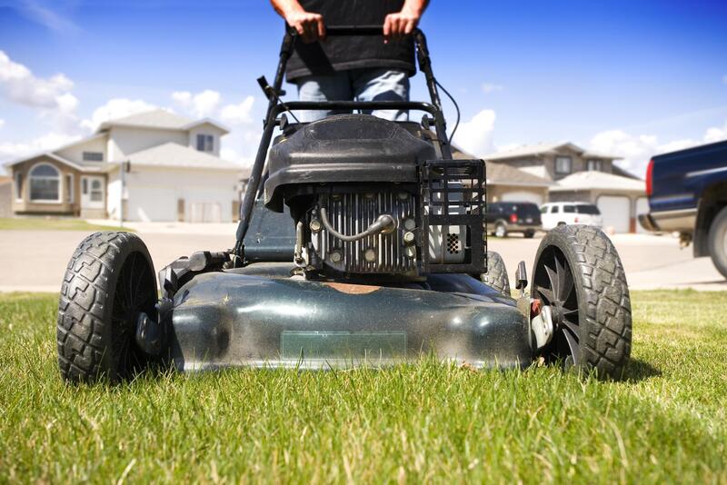 a push mower close up picture ready to mow grass