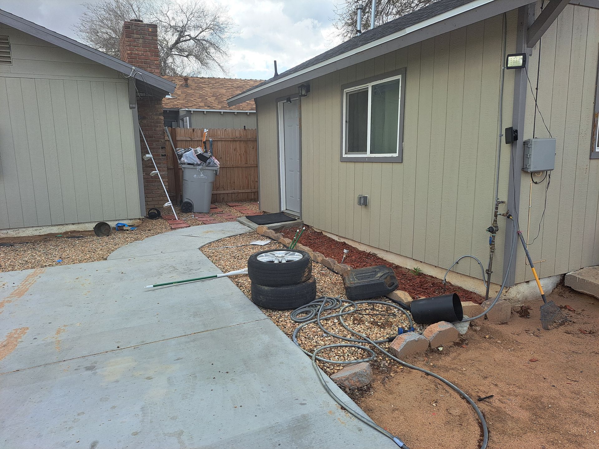 A house with a lot of tires in front of it