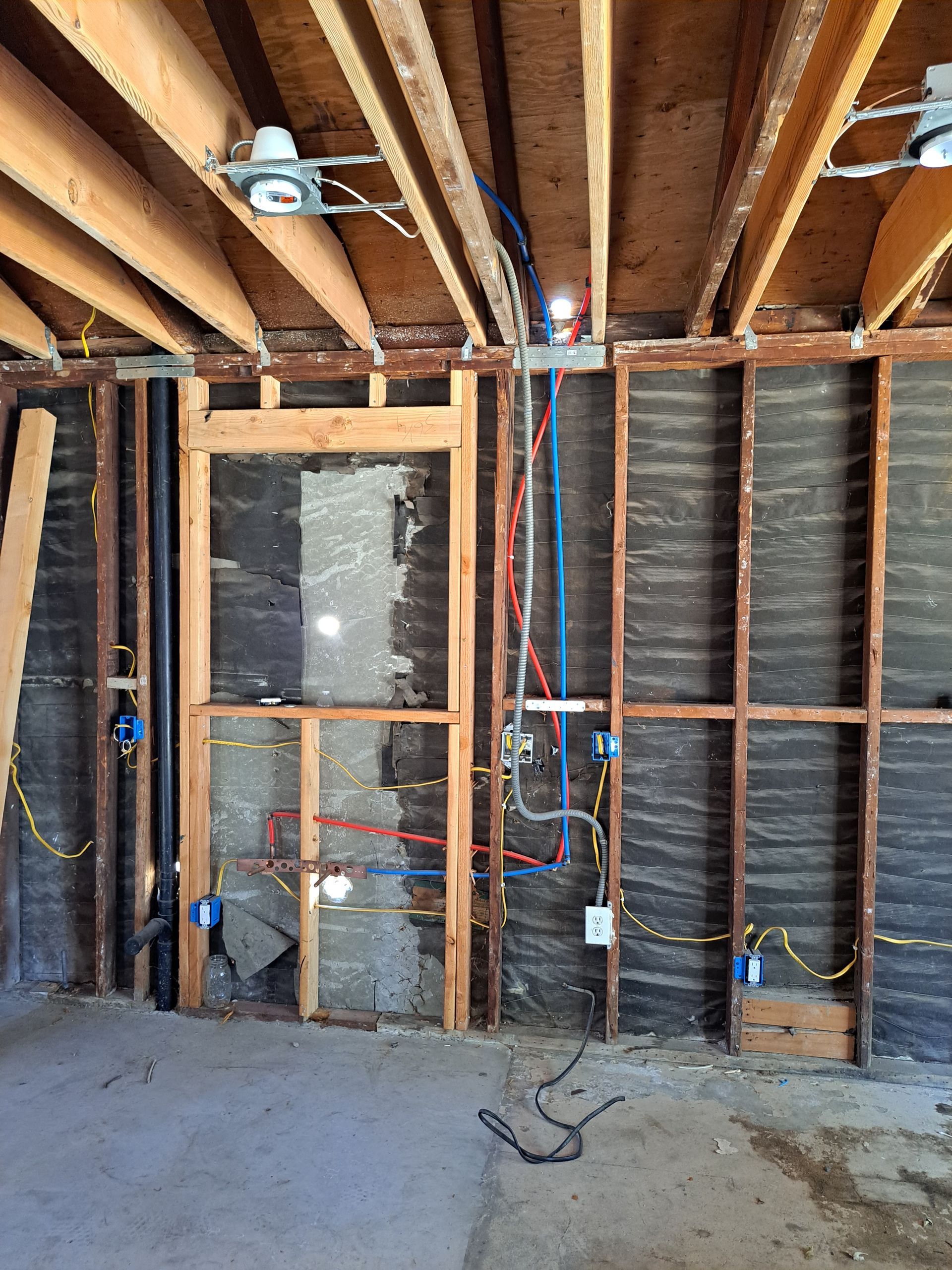 A room with a lot of wires hanging from the ceiling