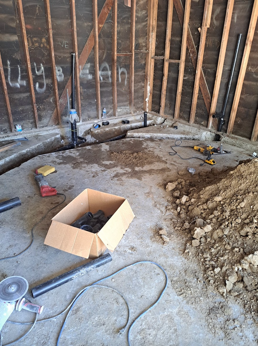 A cardboard box is sitting on the floor of a building.