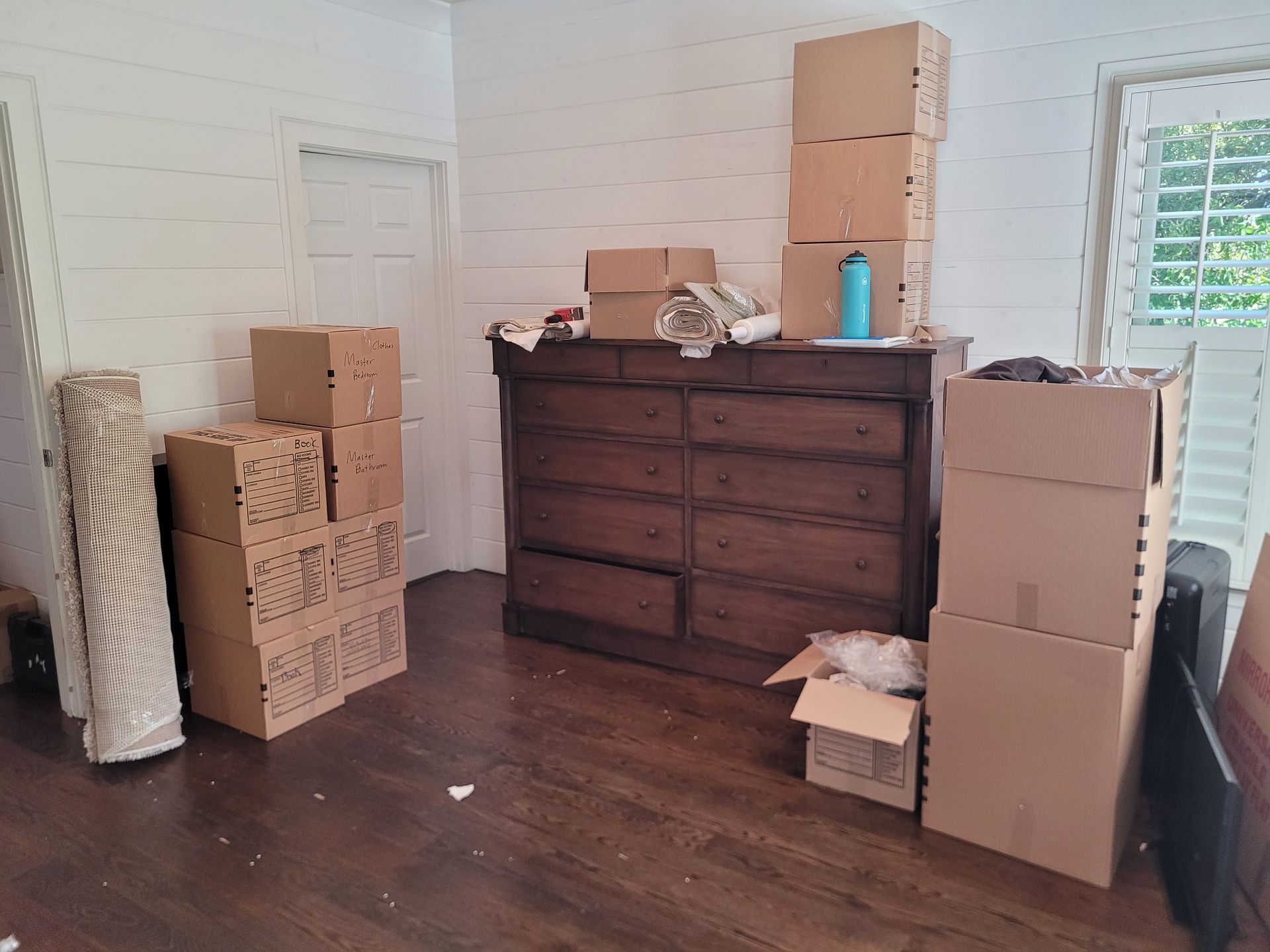 Packed boxes of bedroom items