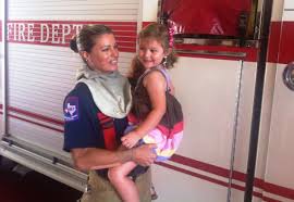 Woman carrying a happy girl - Medical personnel in Upland, CA