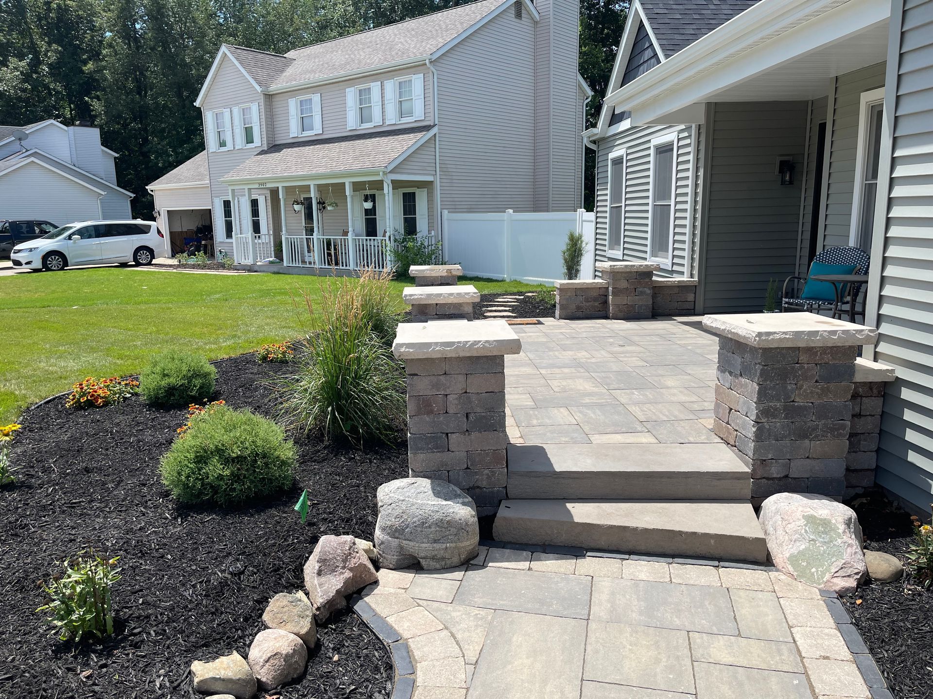 A house with a patio and steps in front of it
