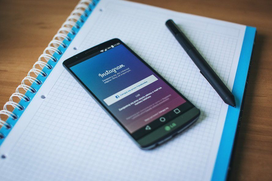 instagram app smartphone on notepad