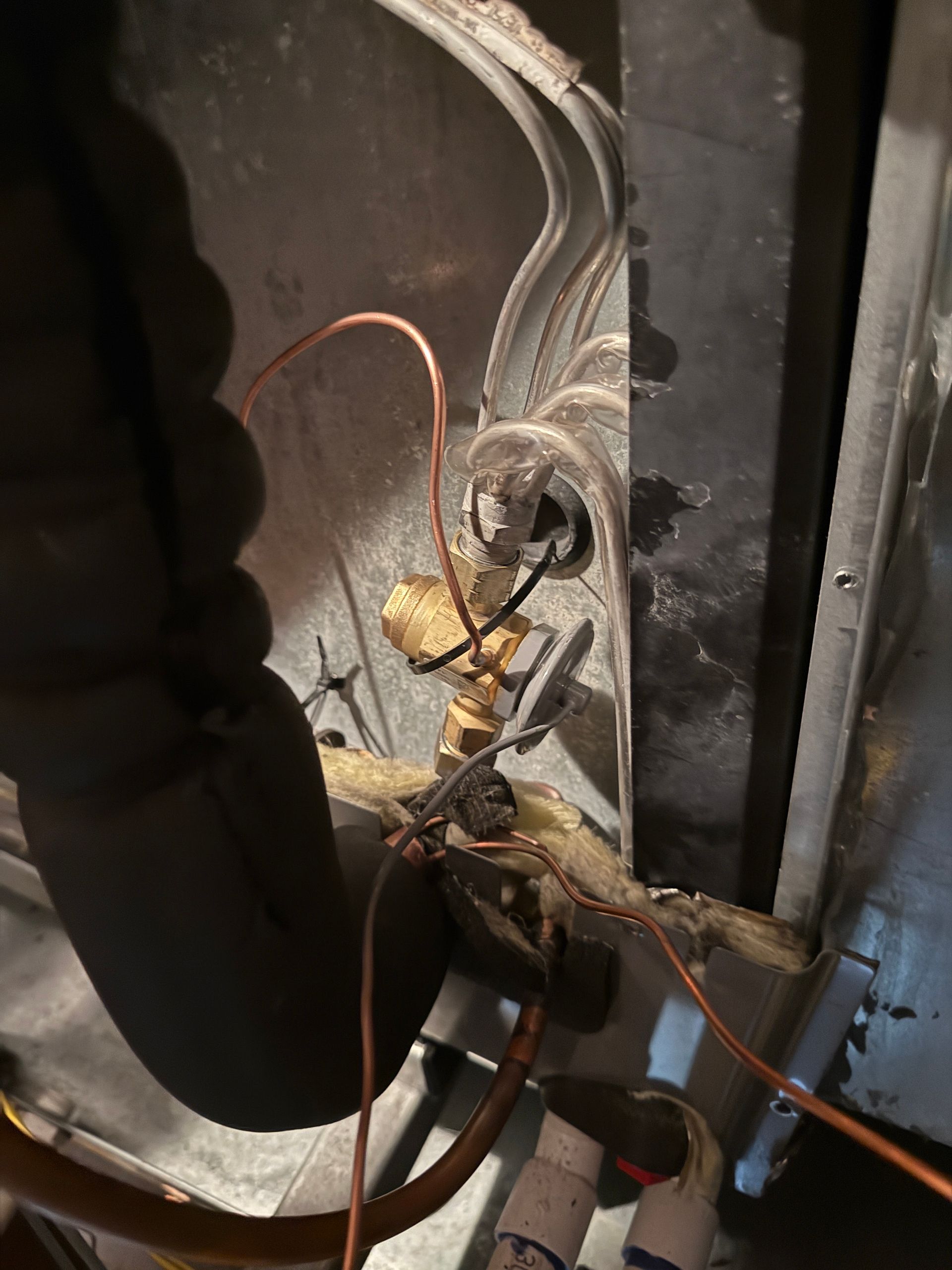 The inside of a moving truck filled with boxes and blankets.