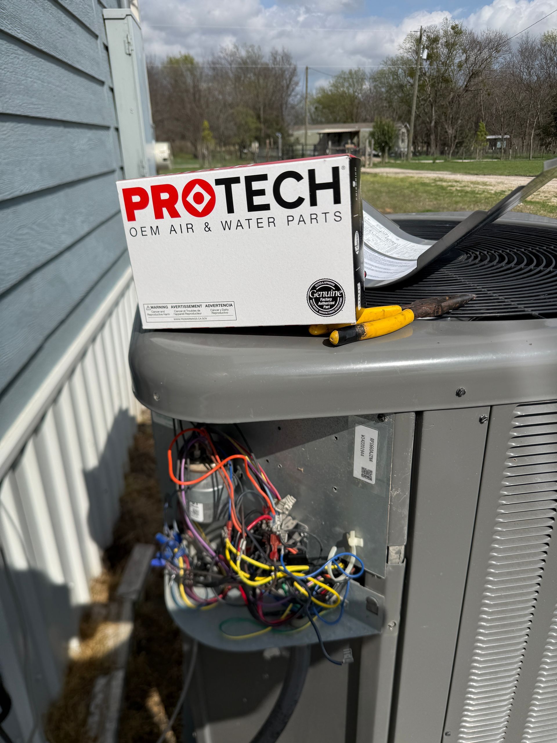 The inside of a moving truck filled with boxes and blankets.