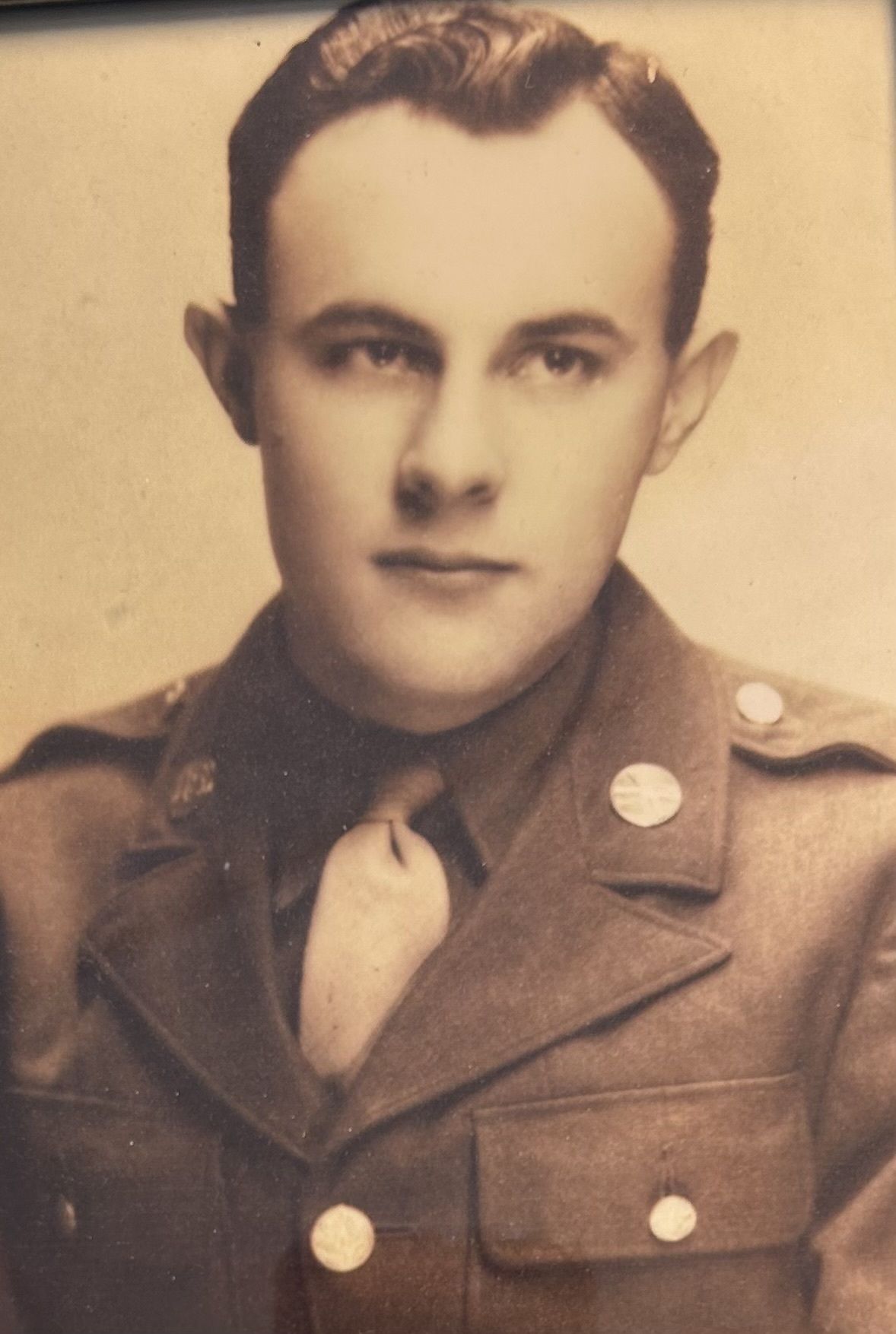 Man in military uniform, portrait; sepia tone.