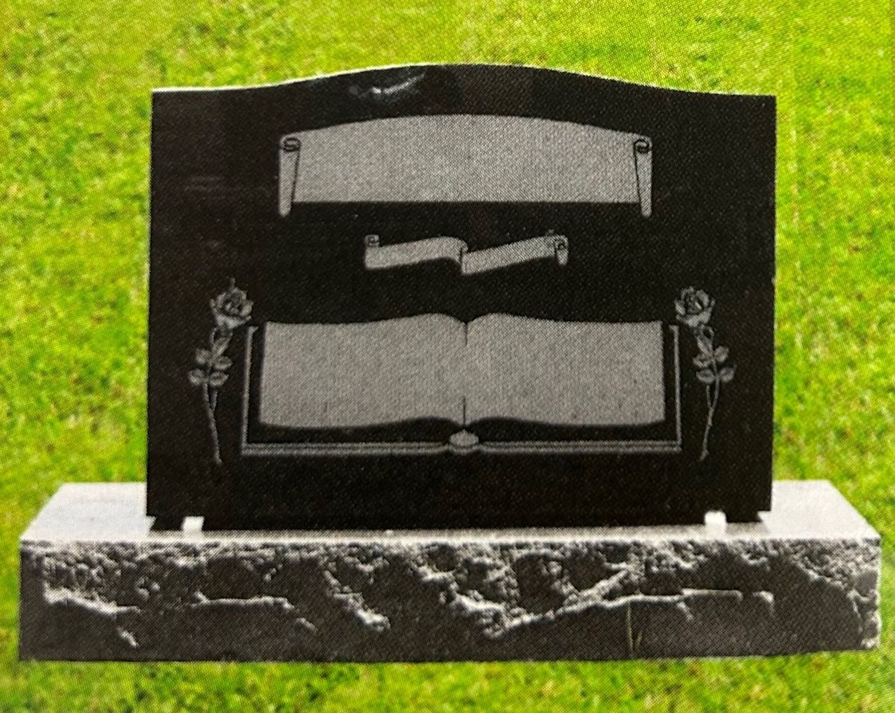 Black granite headstone with decorative scroll and book carvings on a gray stone base.