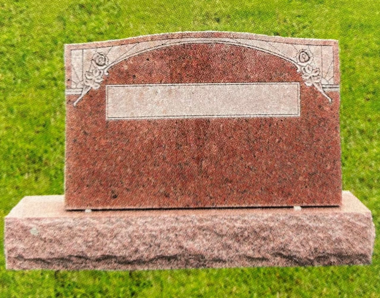Red granite headstone with decorative top on a matching base; set in grass.