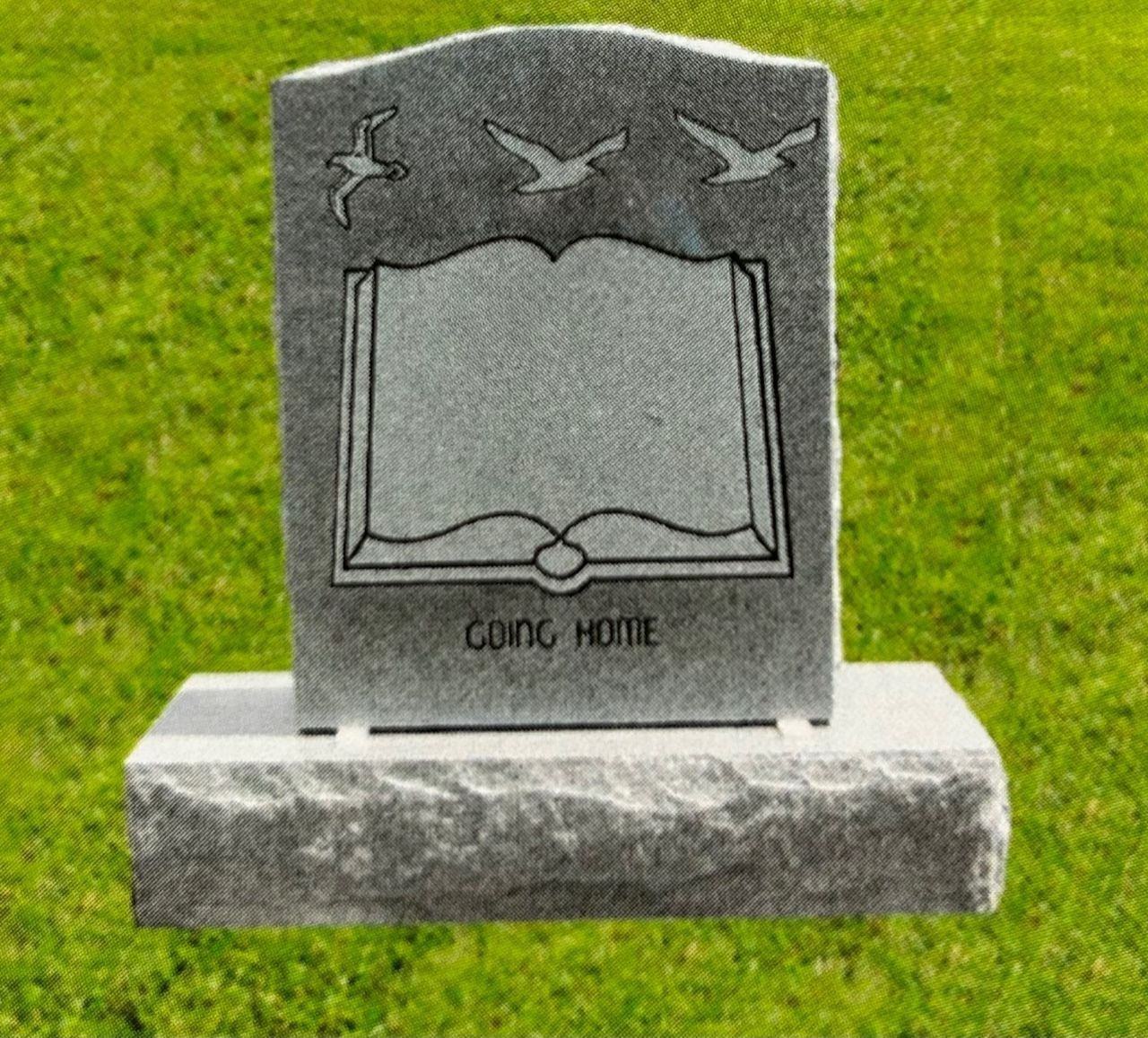 Tombstone with open book design and flying birds; text reads 