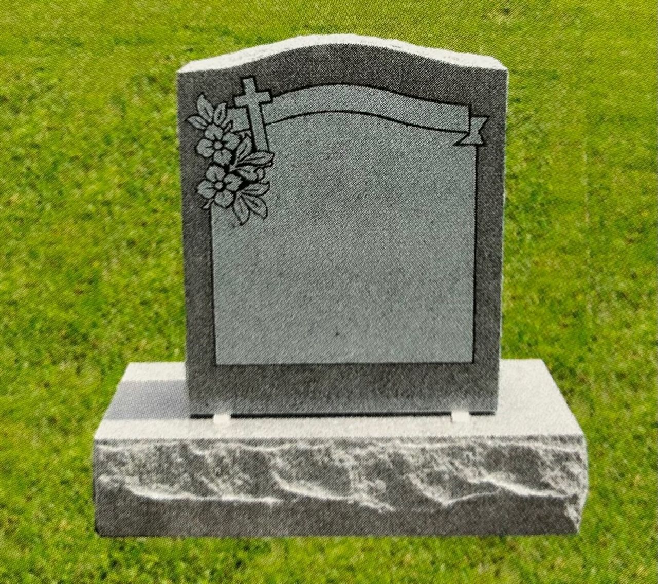 Gravestone with cross and floral design, set on a grassy field.