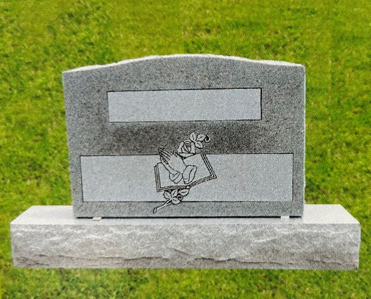 Gray granite headstone with two text panels and a rose and bat carving.