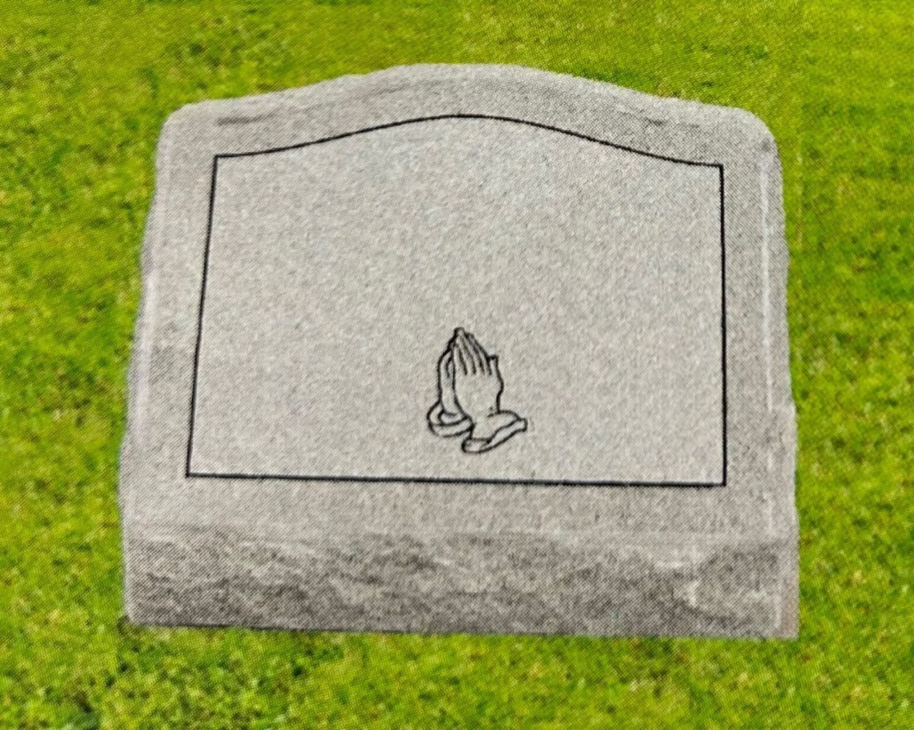 Gray headstone with praying hands.