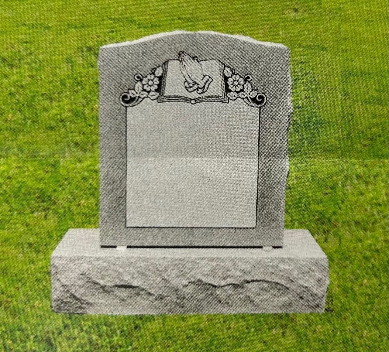 Gray granite headstone with decorative top, blank center plaque, and base on green grass.