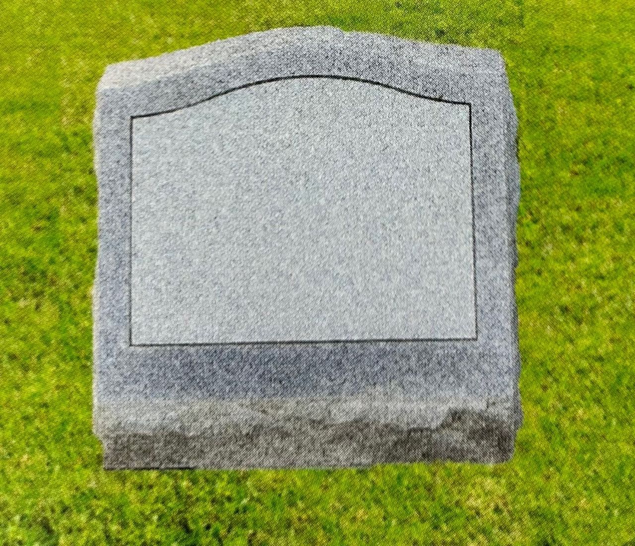 Blank gray granite headstone on green grass.