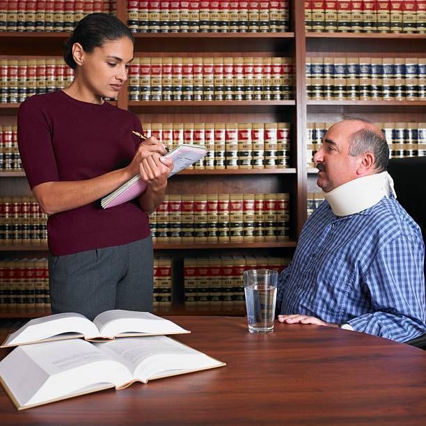 A female personal injury attorney talking to injured client