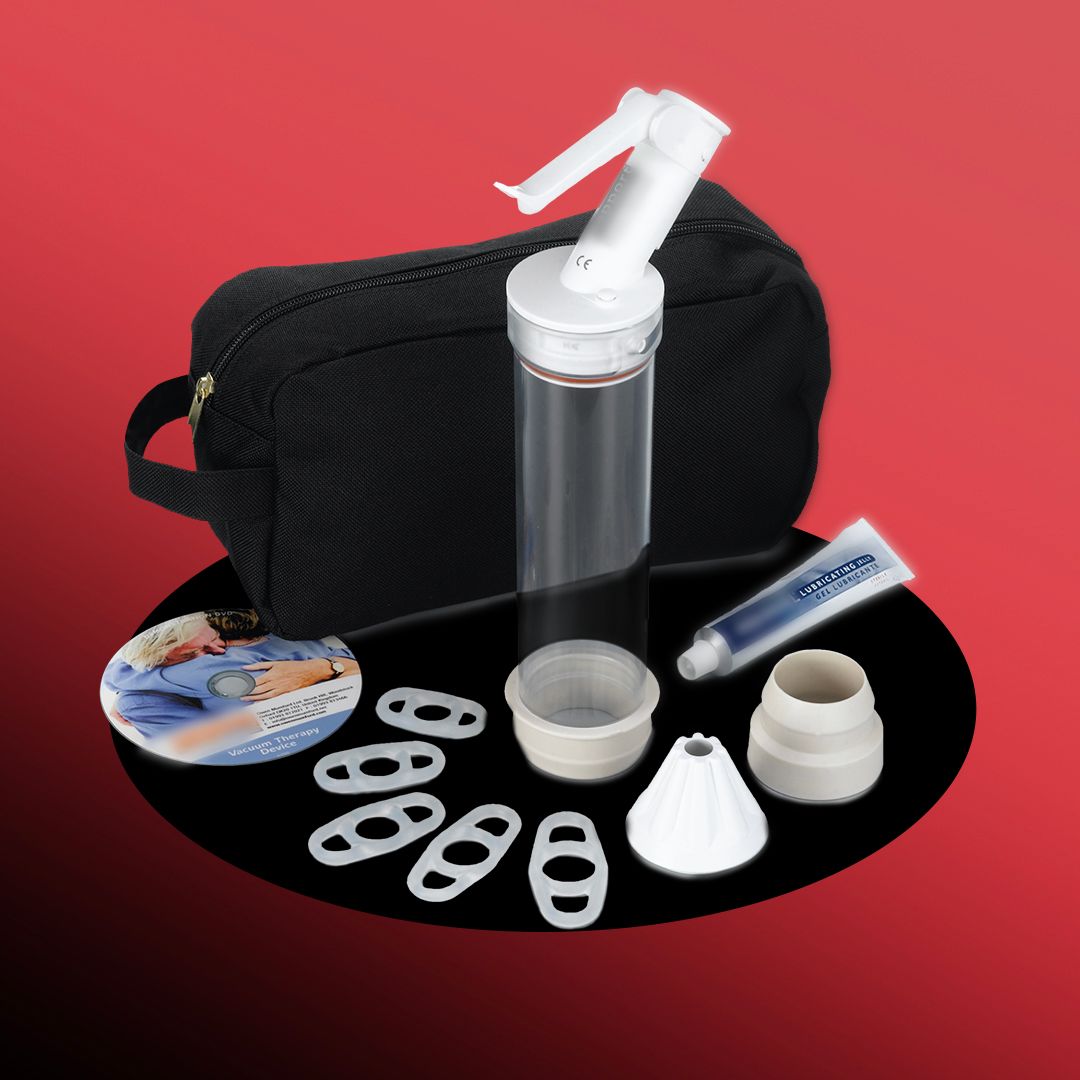A black bag with a pump device and accessories, including a lubricant tube and rings, on a red background.