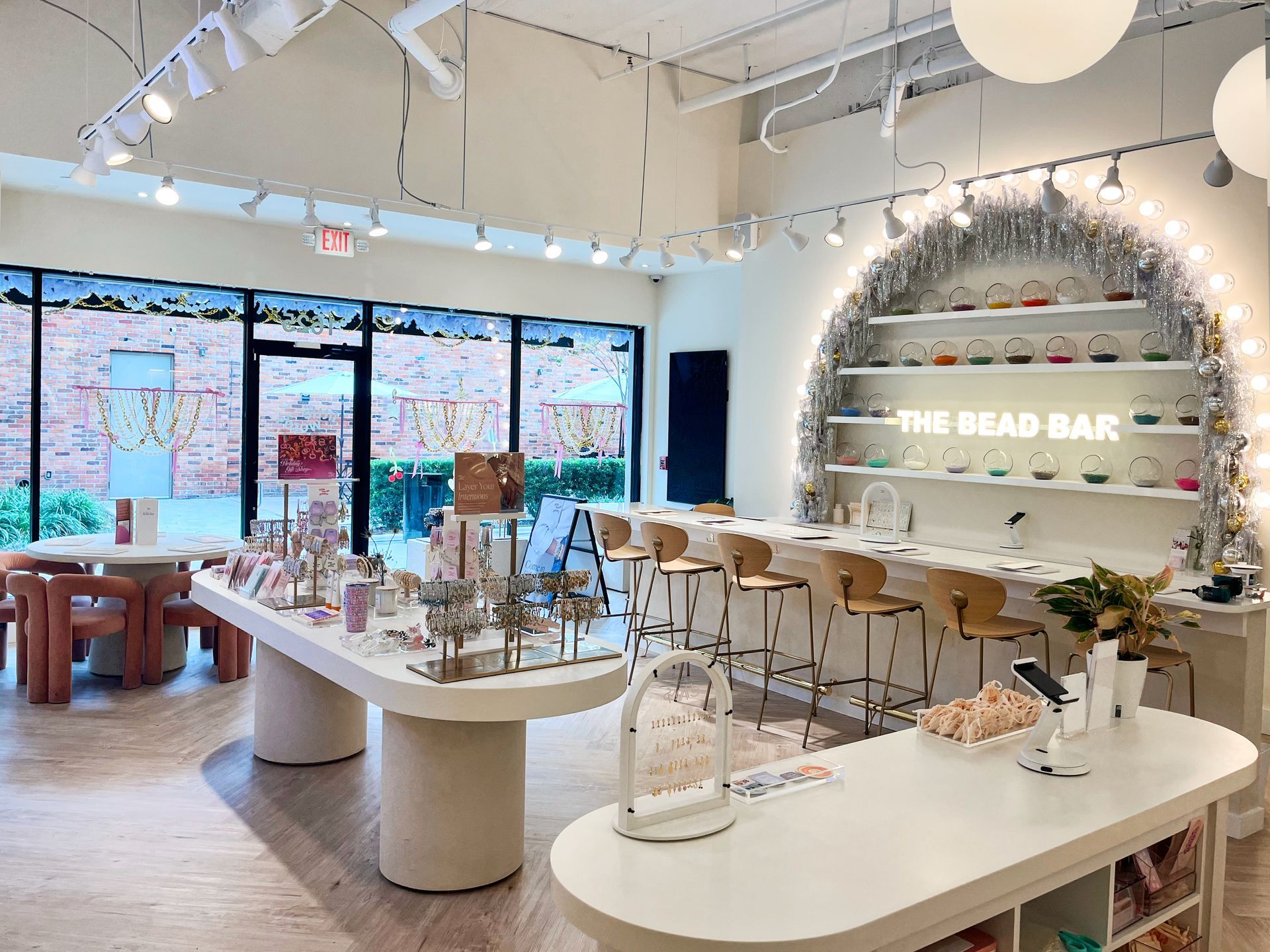 Commercial interior painting for The Bead Bar retail store in Tampa Florida with white walls and exposed ceiling